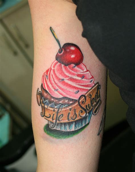 r&b artist with cupcake tattoo.